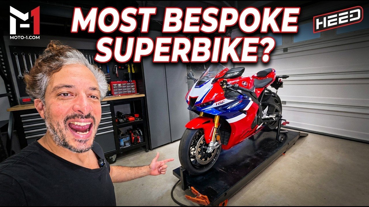 Adam Waheed points to a Grand Prix Red 2026 Honda CBR1000RR-R Fireblade SP on a garage lift in Moto-1 thumbnail art.