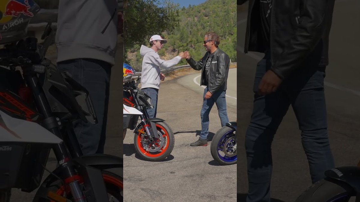 Aaron Colton and Adam Waheed shake hands beside the 2026 KTM 990 Duke R and Yamaha MT-09 SP in Head 2 Head Episode 2
